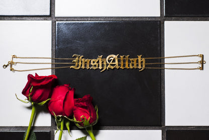 Choker with 'InshAllah' on a black square, surrounded by red roses on a checkered background.