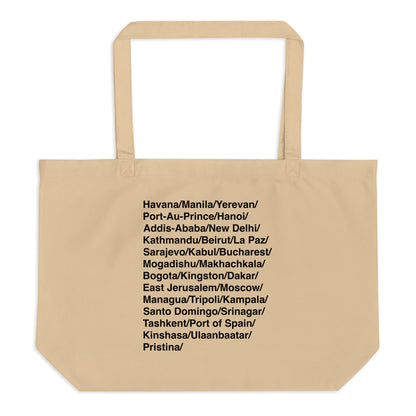 Beige tote bag with black text listing various city names on a white background