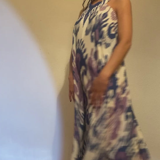 A video of a woman showing her flowing blue, purple and white ikat dress.