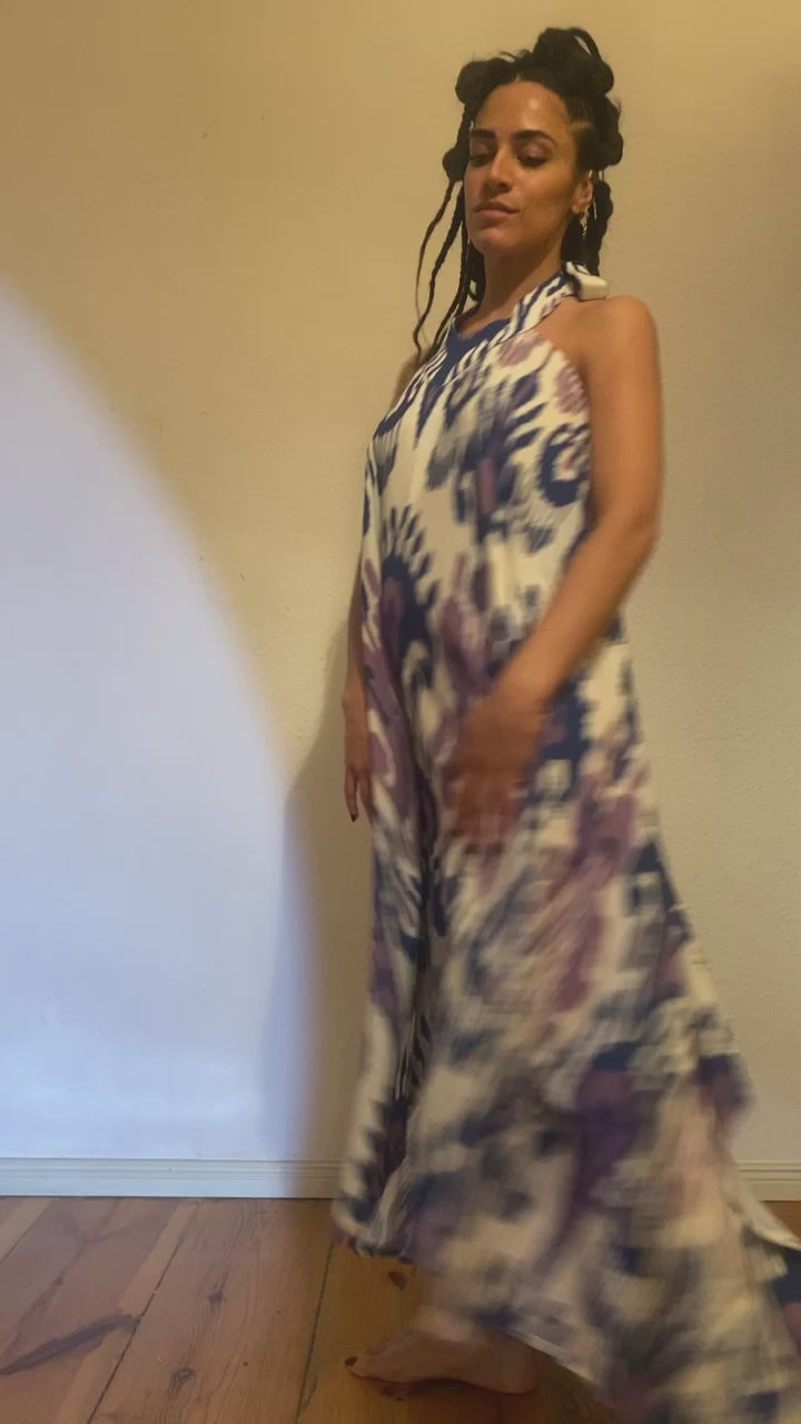 A video of a woman showing her flowing blue, purple and white ikat dress.