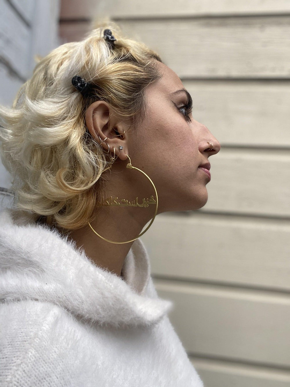 Blonde woman wearing the It's All Good/ Khair Ast Kaka Jaan 24 k gold plated Hoops - Blingistan