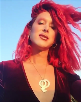 The Pride and Patriarchy Male & Female Necklace - Blingistan, person with red hair wearing maroon velvet top and gold plated symbolic necklace.