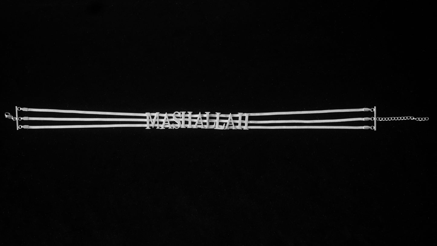 Silver MashAllah choker on a black backdrop.