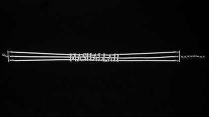Silver MashAllah choker on a black backdrop.