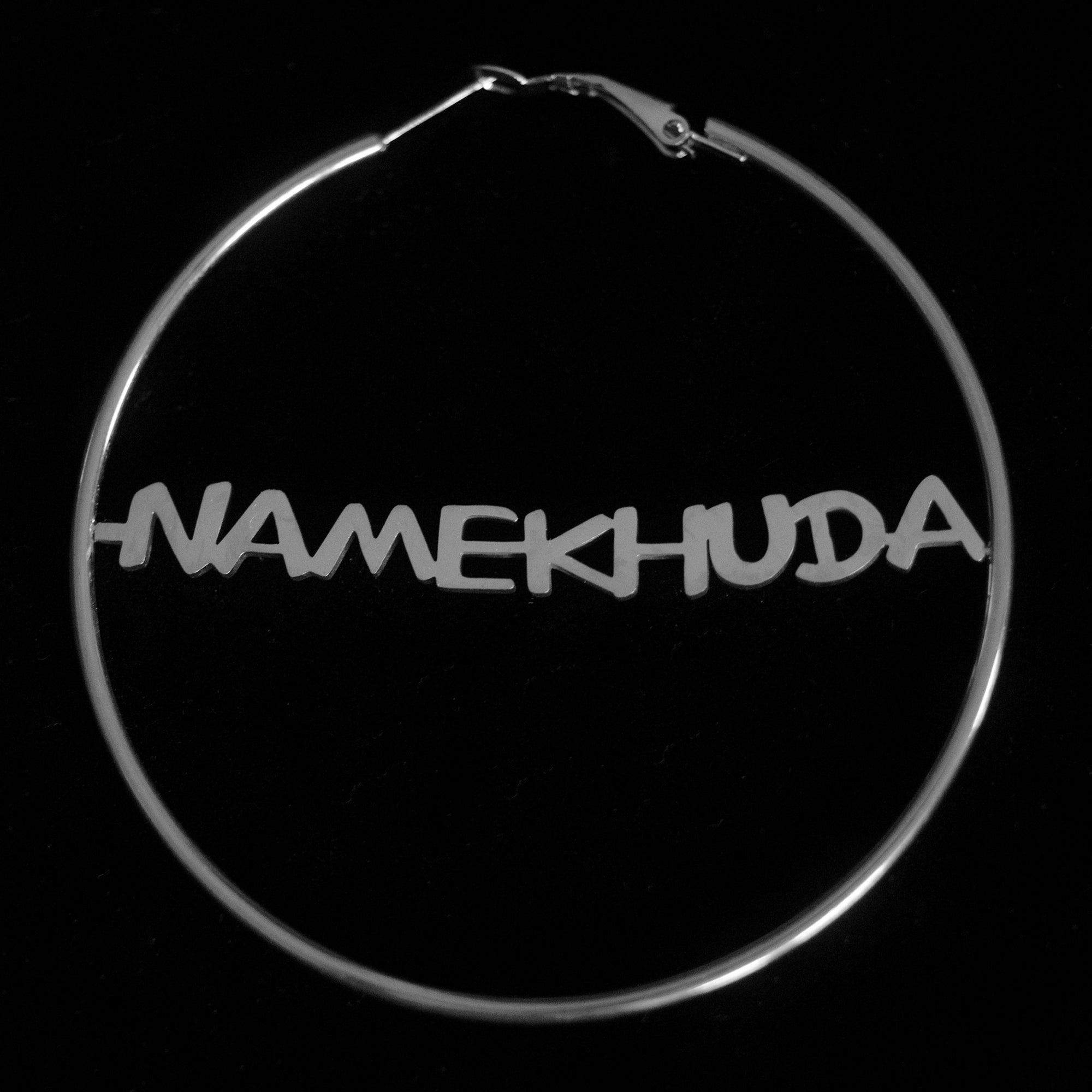 Silver Hoops with the word 'Namekhuda' written in Latin alphabet against a black background.